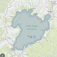 Map showing Lake Taupo in New Zealand, labeled Lake Taupo (Taupomoana), surrounded by towns, roads, and nearby attractions—including the location of a prestigious Taupō lifestyle estate for sale—with contours of the surrounding land visible.